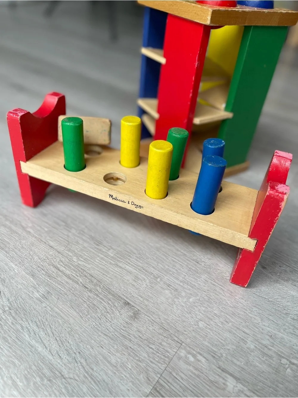Melissa & Doug Wooden Pound-and-Play Bench in Red, Green, Blue, Yellow